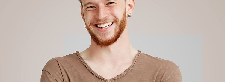 Smiling in Brown Shirt