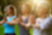 Women Practicing Yoga Outdoors