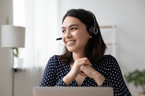 Woman wearing headset while working from home