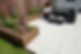 Garden patio with paving and timber sleeper flower beds