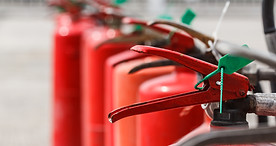 Red fire extinguishers available in fire emergencies