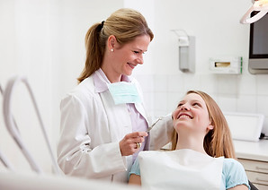 Dentist with patient in surgery