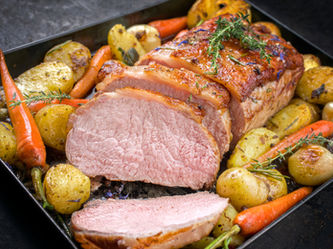 Roast pork with roast potatoes and carrots