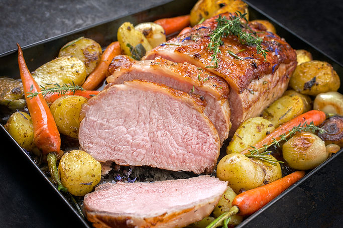 Roast pork with roast potatoes and carrots