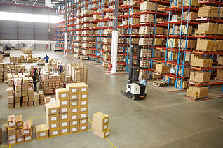 Elevated view of large distribution warehouse storing boxes of clothing