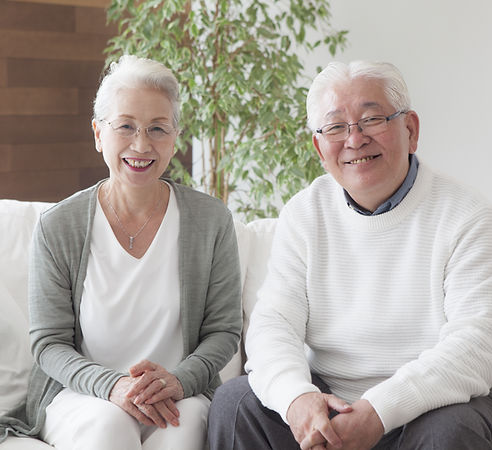 Two smiling elderly people