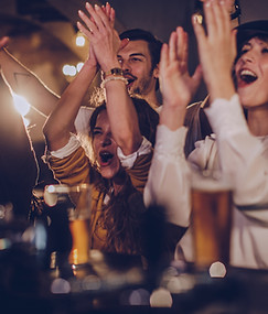 Friends Cheering in Pub