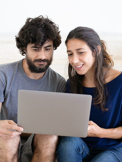 Couple Using Laptop