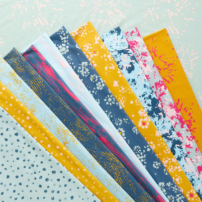 Coordinated fabric swatches in yellow, blue and pink with floral and abstract
prints.