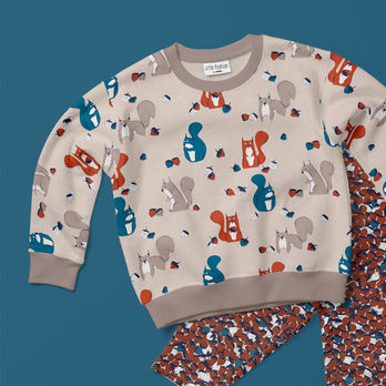 Kids pyjama mockup with squirrels, acorns and woodland motifs.