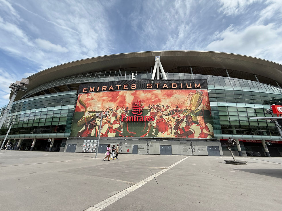 The outside of Arsenal's Emirates Stadium under blue cloudy skies