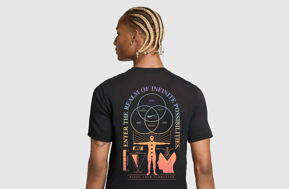 Person wearing black tee with cosmic-style print and text "Enter the realm of infinite possibilities".