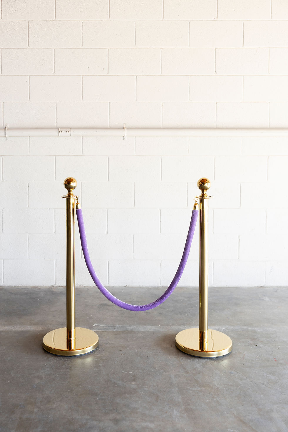 Thumbnail: Gold stanchions with purple velvet rope