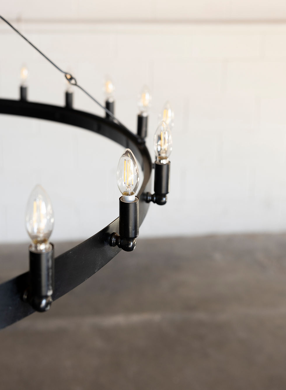 Thumbnail: Black metal chandelier with exposed bulbs