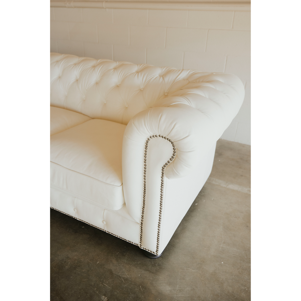 Thumbnail: White tufted sofa with decorative studs
