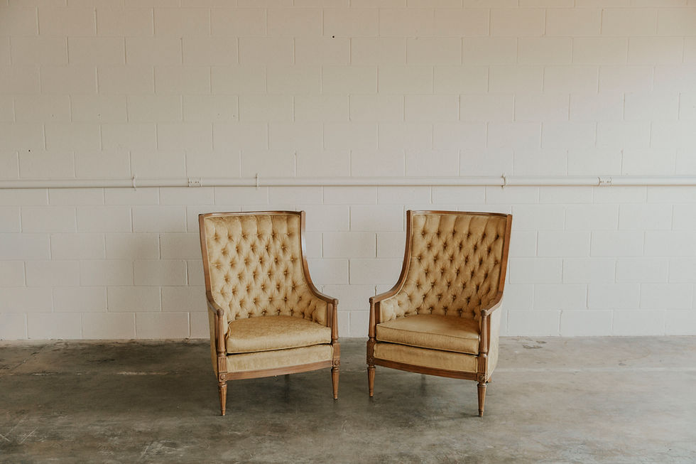 Two vintage tufted armchairs
