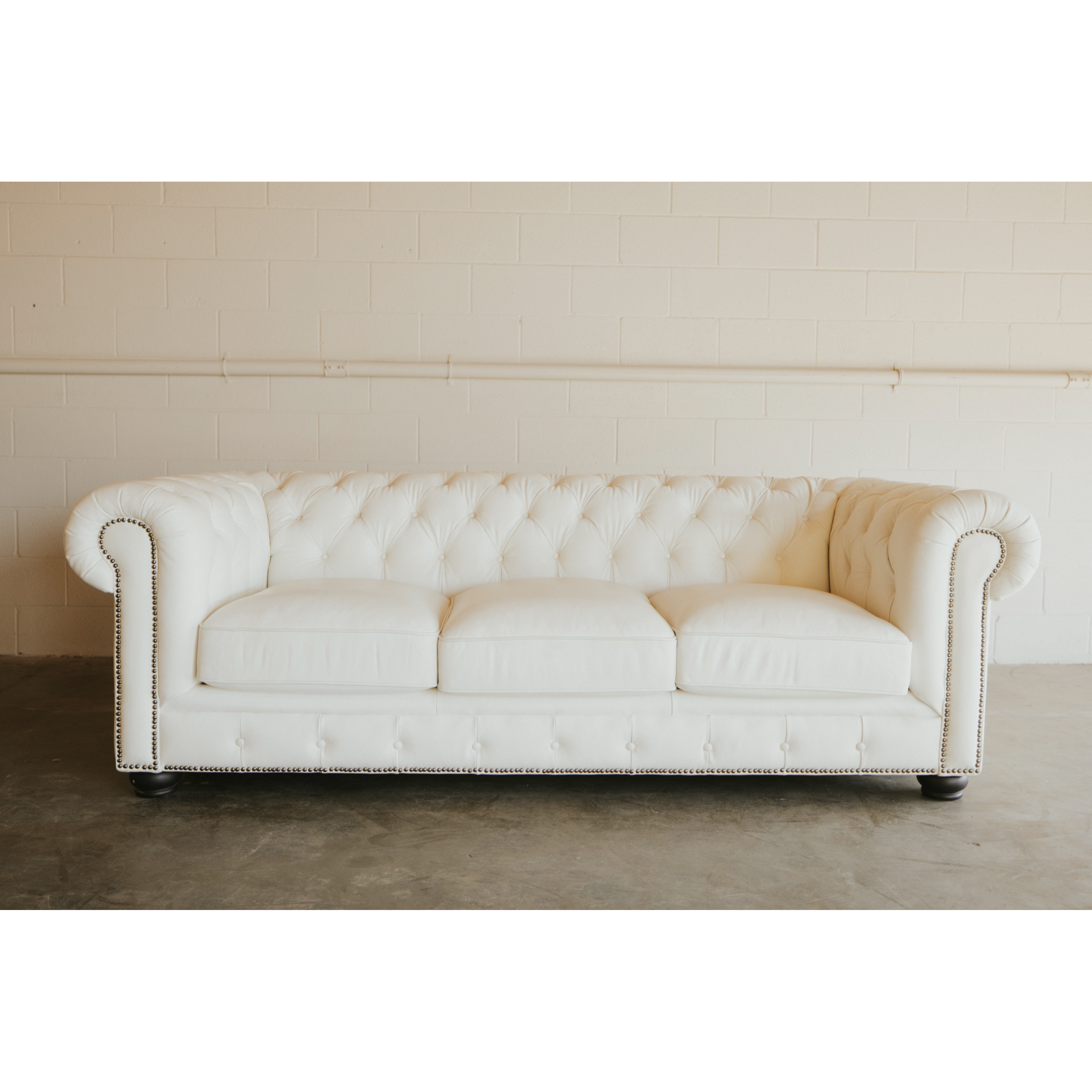 White tufted sofa