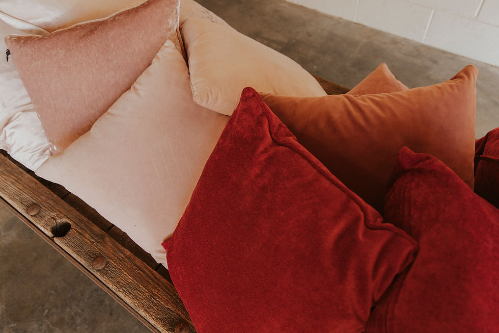 Thumbnail: Cozy red, orange, and pink pillows