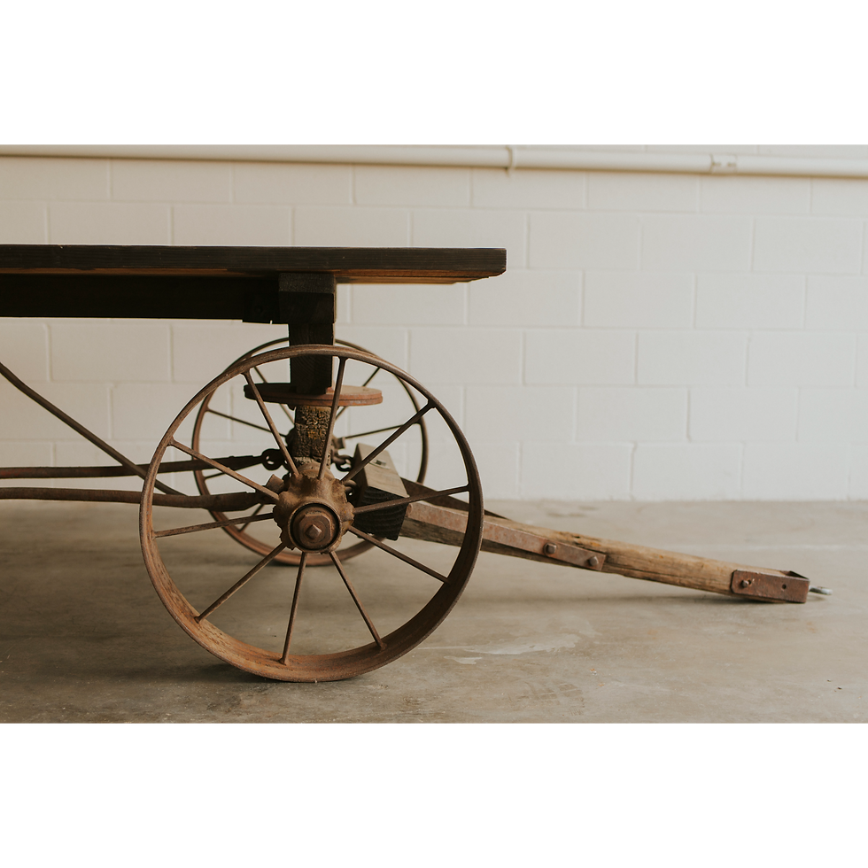 Thumbnail: Rustic vineyard trailer with large metal wheel