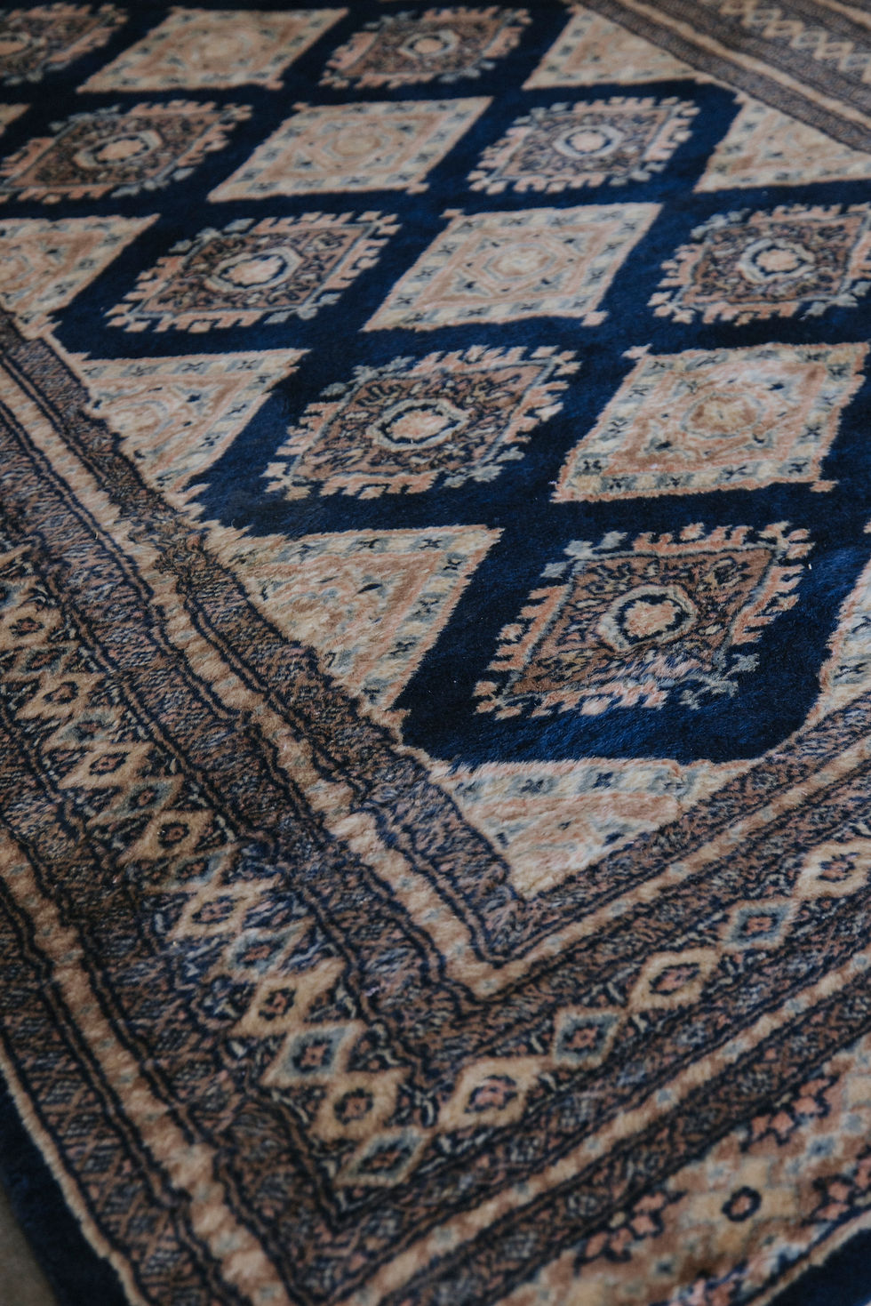 Thumbnail: Blue and beige patterned rug detail