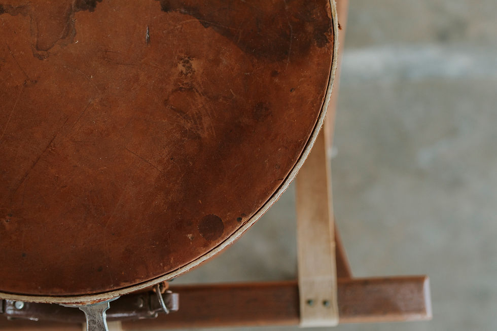 Thumbnail: Detail of brown leather suitcase with strap