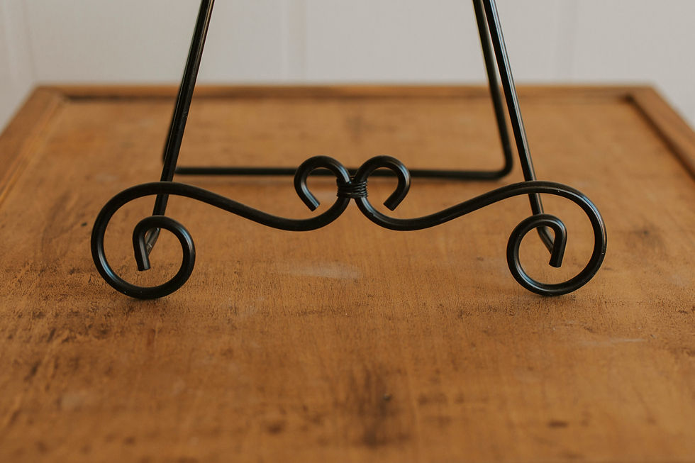 Thumbnail: Black metal easel base with scrolls