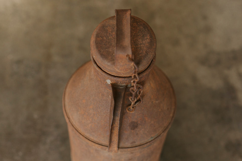 Thumbnail: Rusty milk can with chained lid, top view