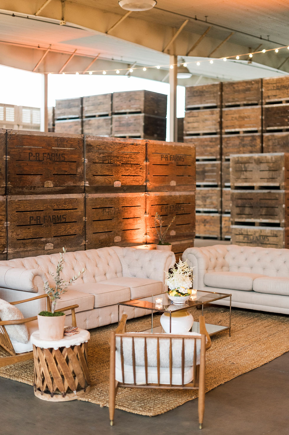 Thumbnail: Elegant event lounge with white sofas, wooden crates
