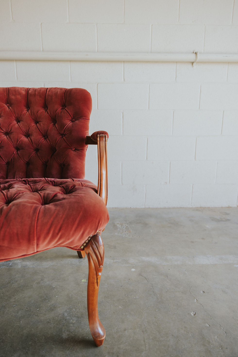 Thumbnail: Vintage red velvet tufted couch