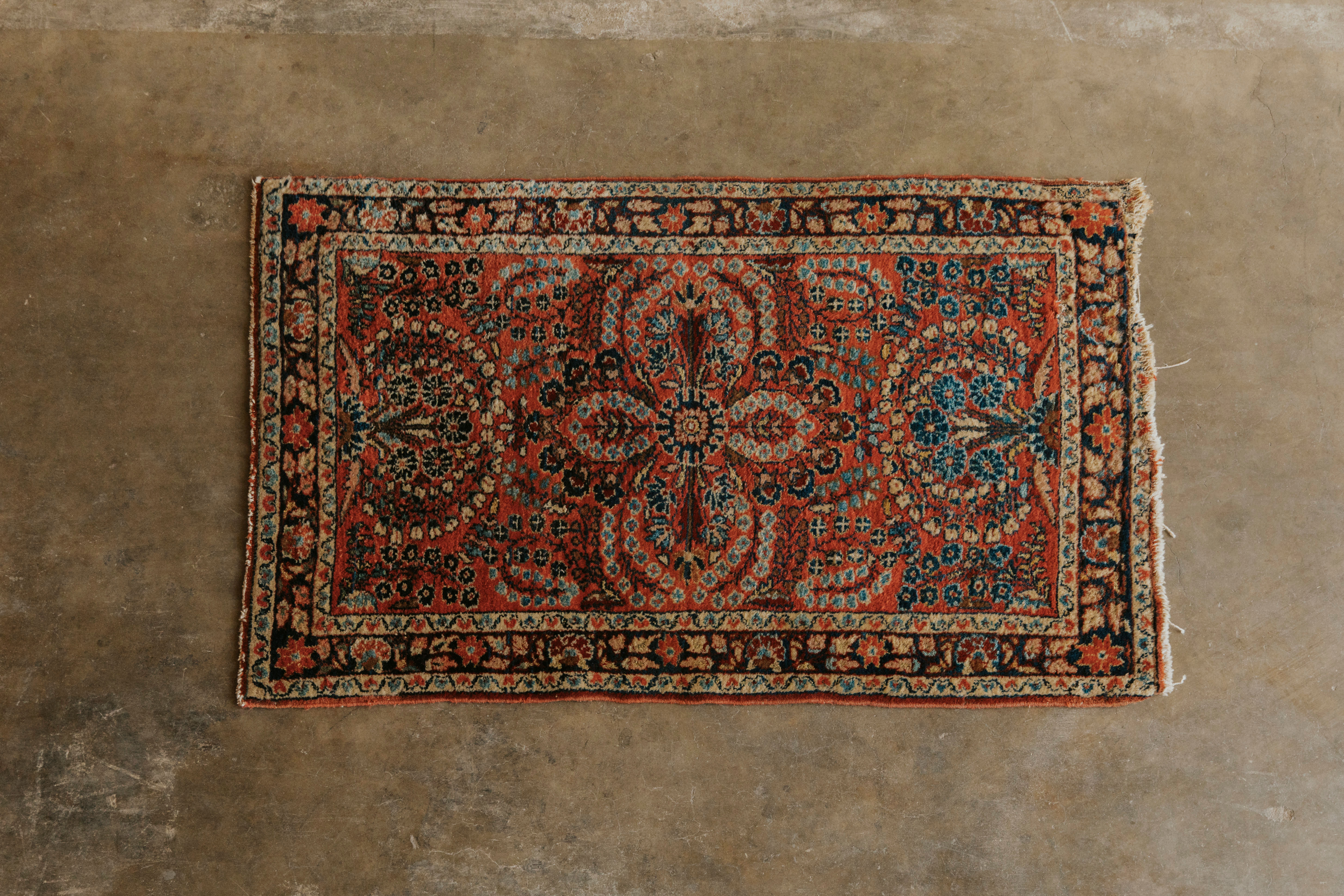 Ornate red and blue patterned rug