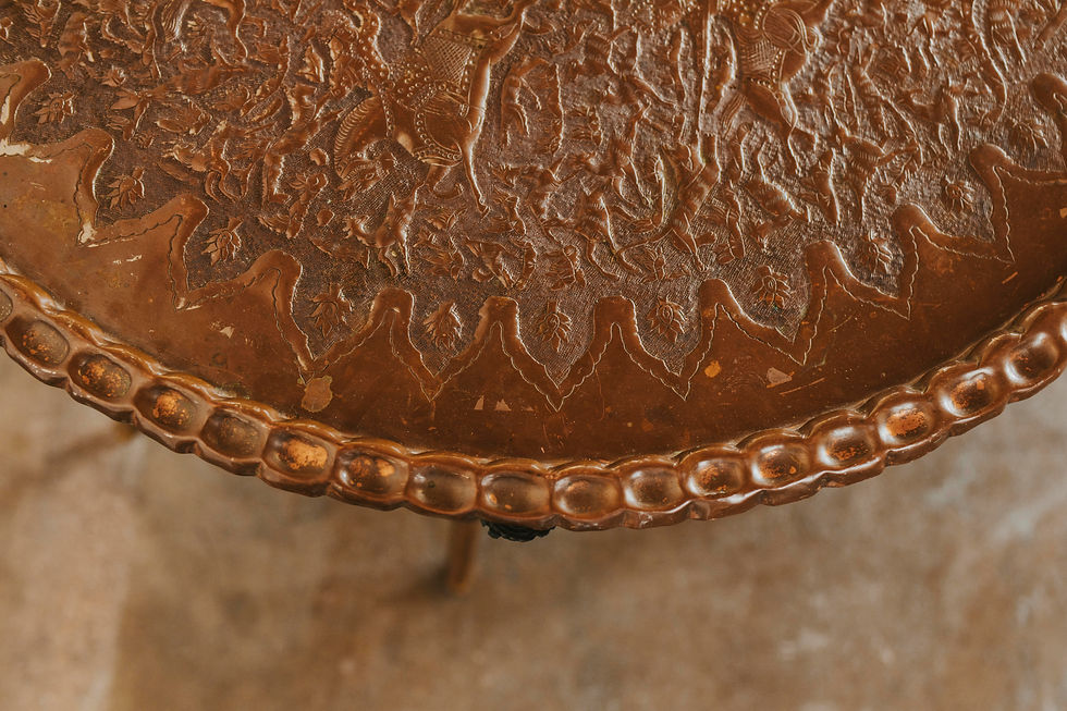 Thumbnail: Ornate metallic tray with embossed patterns