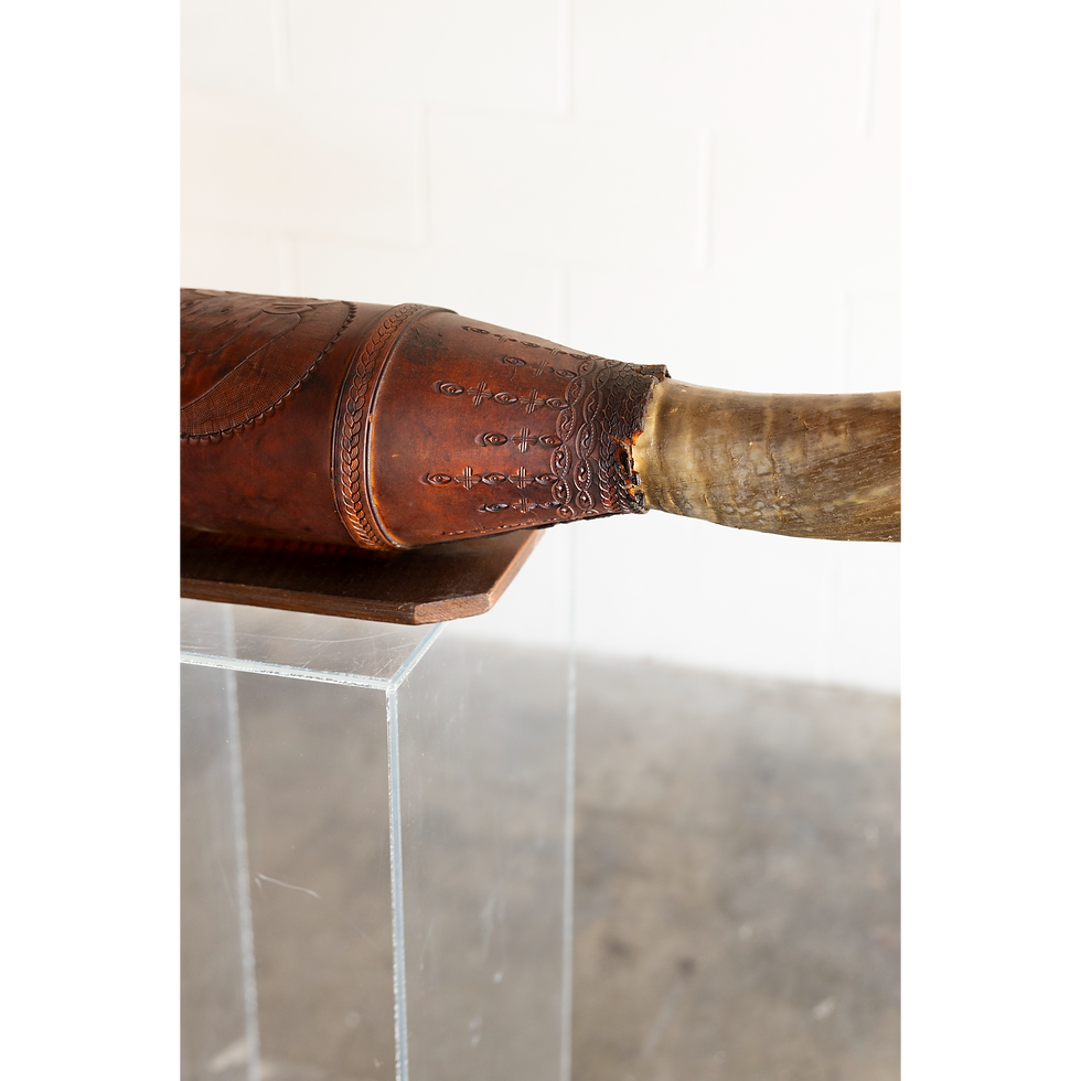 Thumbnail: Carved dark wooden object with wrapped handle