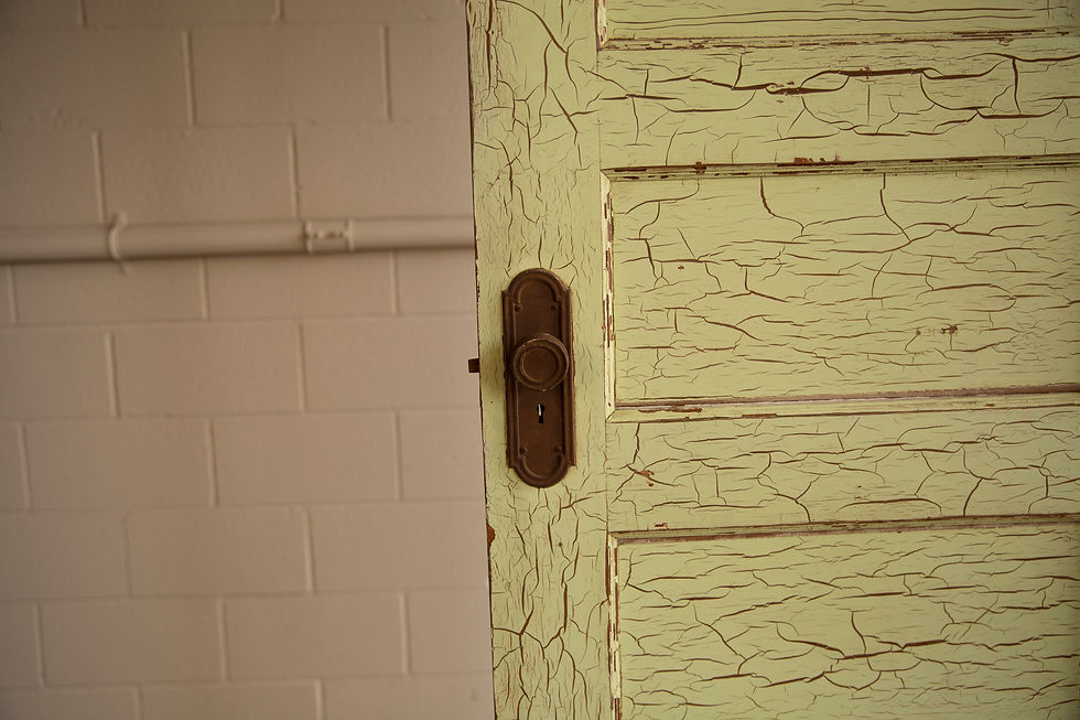Thumbnail: Distressed lime green door with old doorknob