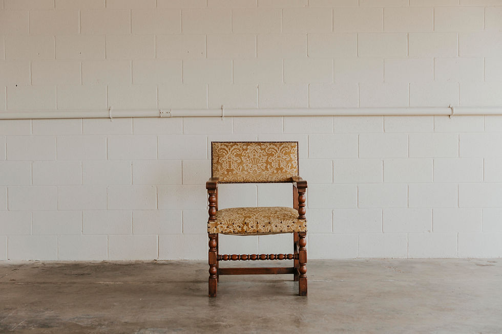 Ornate wooden chair with patterned fabric