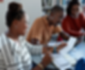 group of people sitting at a desk