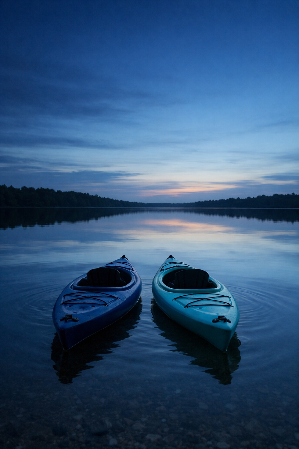 two kayaks on still water