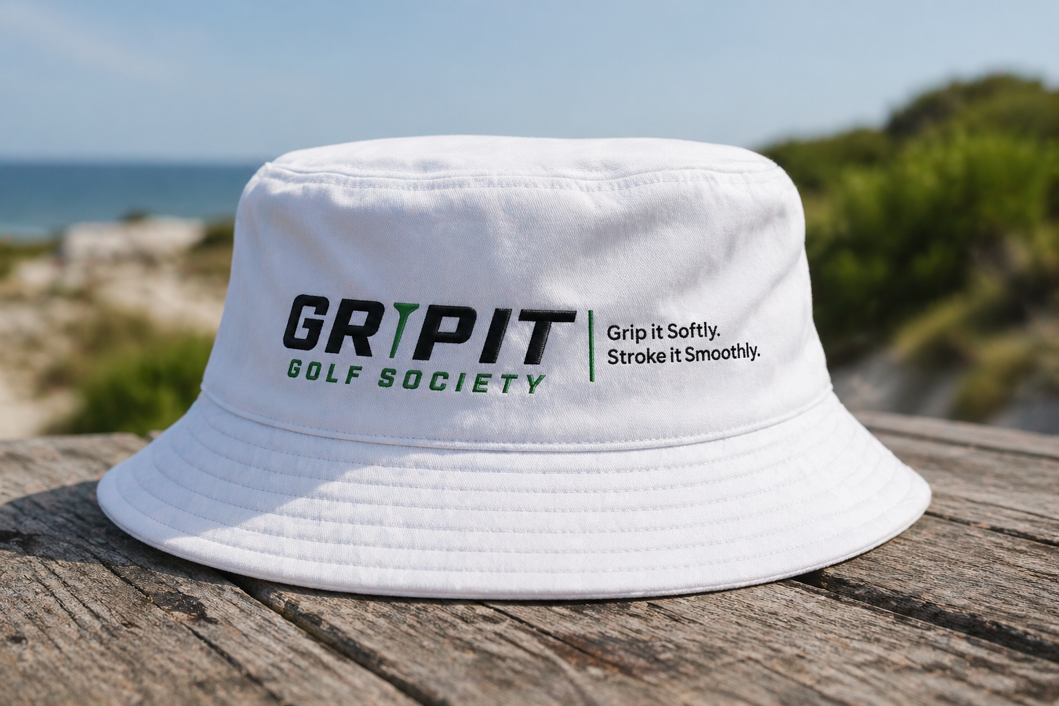 White GRIPIT bucket hat with golf motto
