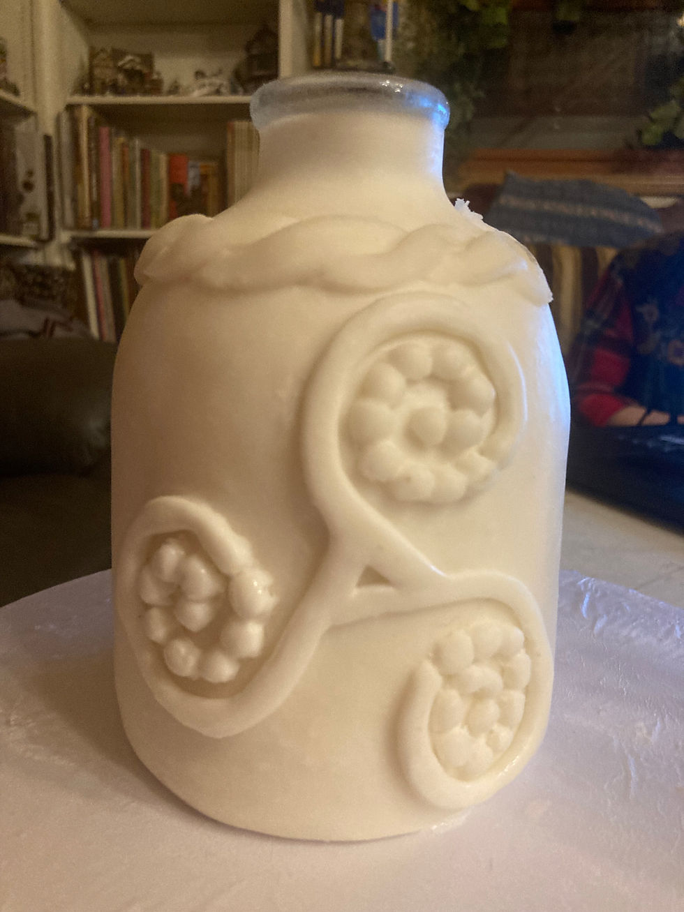 Air dry clay over glass bottle. Triskel representation of Eavan Bolan's poetry, where Ireland is always a woman.