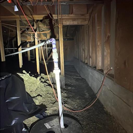 Home inspection taking place in the crawl space