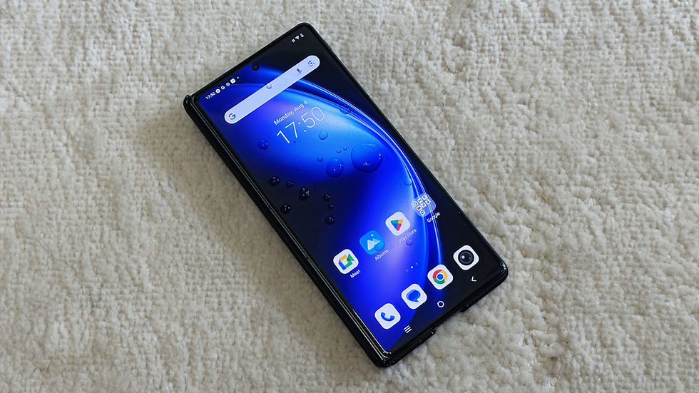 Smartphone on beige carpet, showing a blue-themed home screen with apps and time at 17:50. Modern design, sleek appearance.