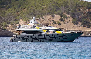 Camouflaged motor yacht