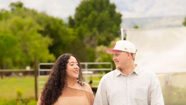 Couple walking during surprise Colorado proposal