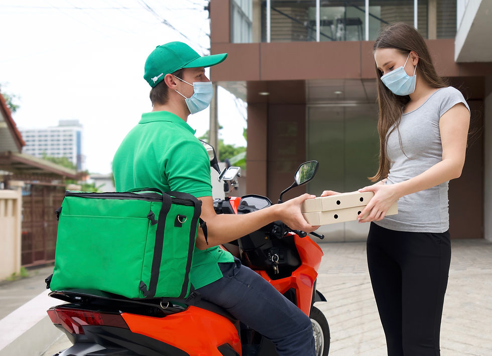 delivery-person-wearing-mask-giving-parcel-woman-outside-home.jpg