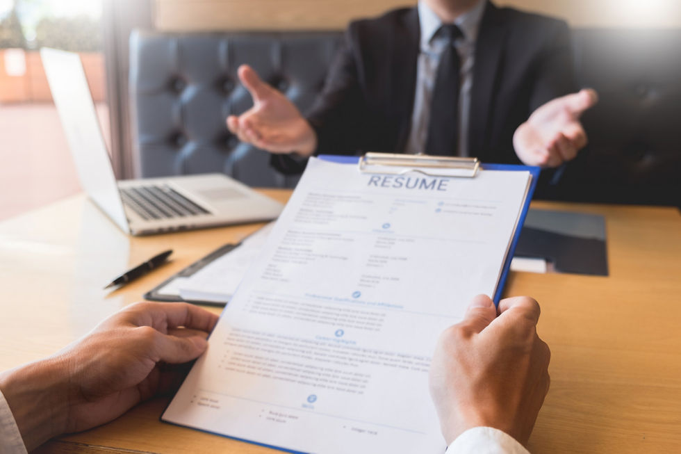 Person holding a resume during a job interview