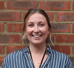 Smiling woman, brick wall background