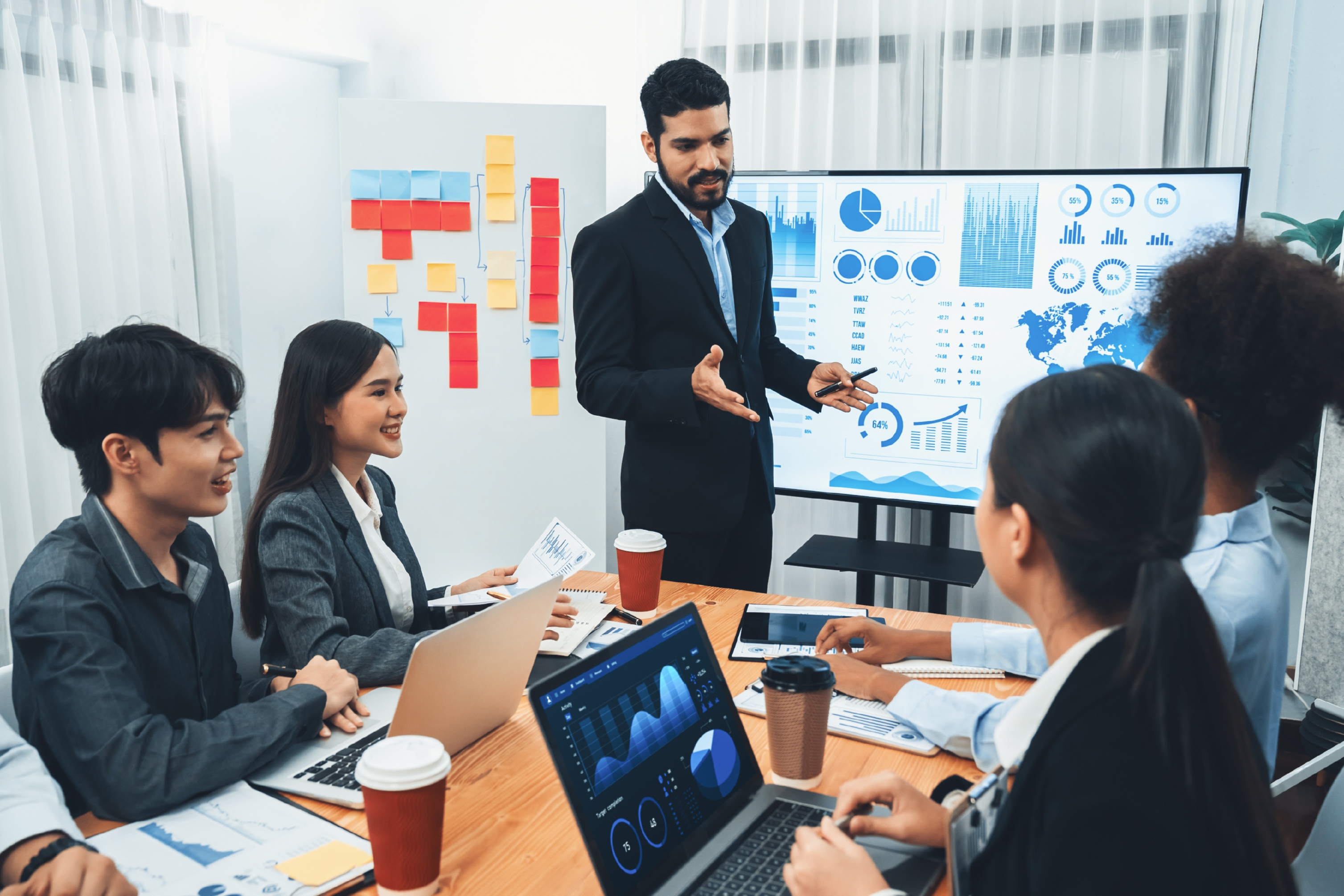 businessman-presenting-data-analysis-dashboard-display-tv-screen-modern-meeting-marketing-