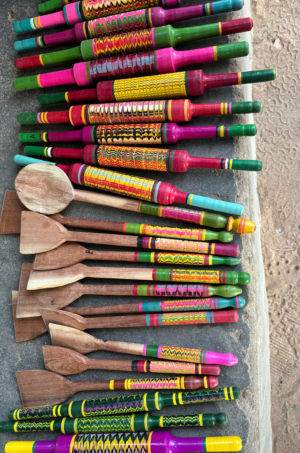 Colour wooden kitchen utensils for sale in Nirona - Photo @ Siân Warren