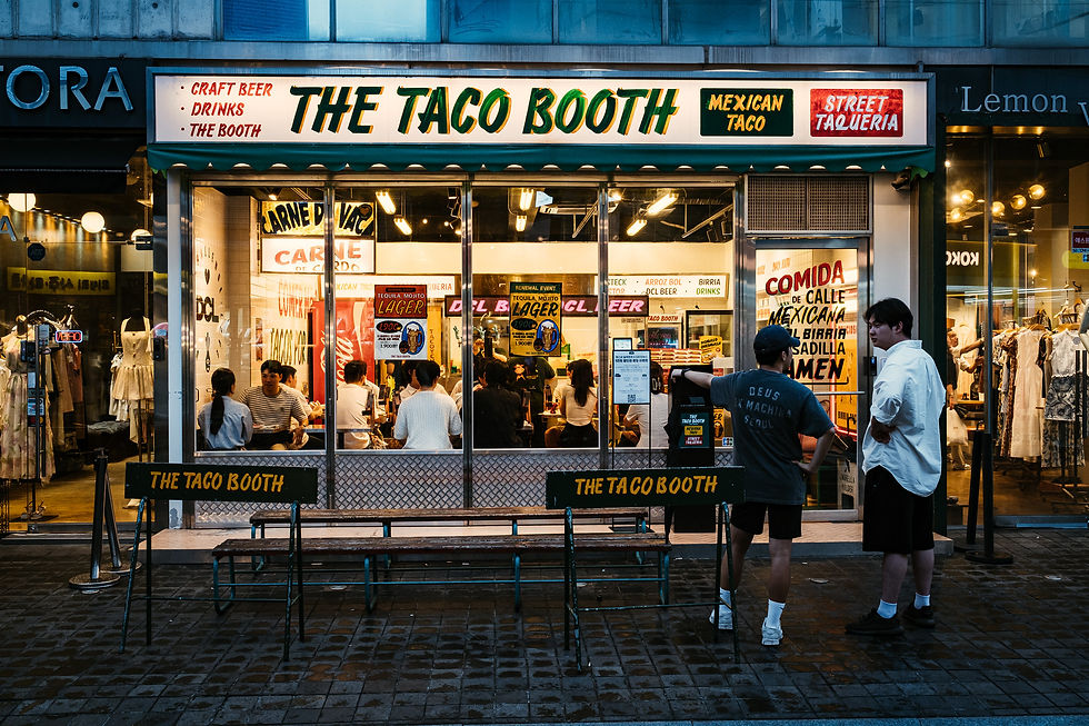 Ah, Gangnam! Where your selfie can feature a designer storefront, a luxury car, and a neon-lit "Taco Booth" because... Korea!