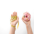 hands-hold-donut-measuring-tape-white-isolated-copy-space.jpg