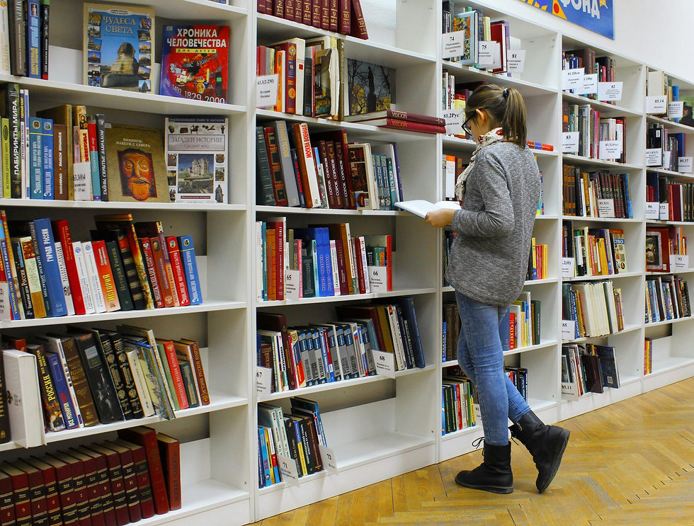 a girl reading in library